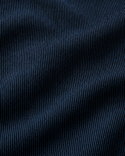Colcha multiusos Pere en combinación Negro-Celeste